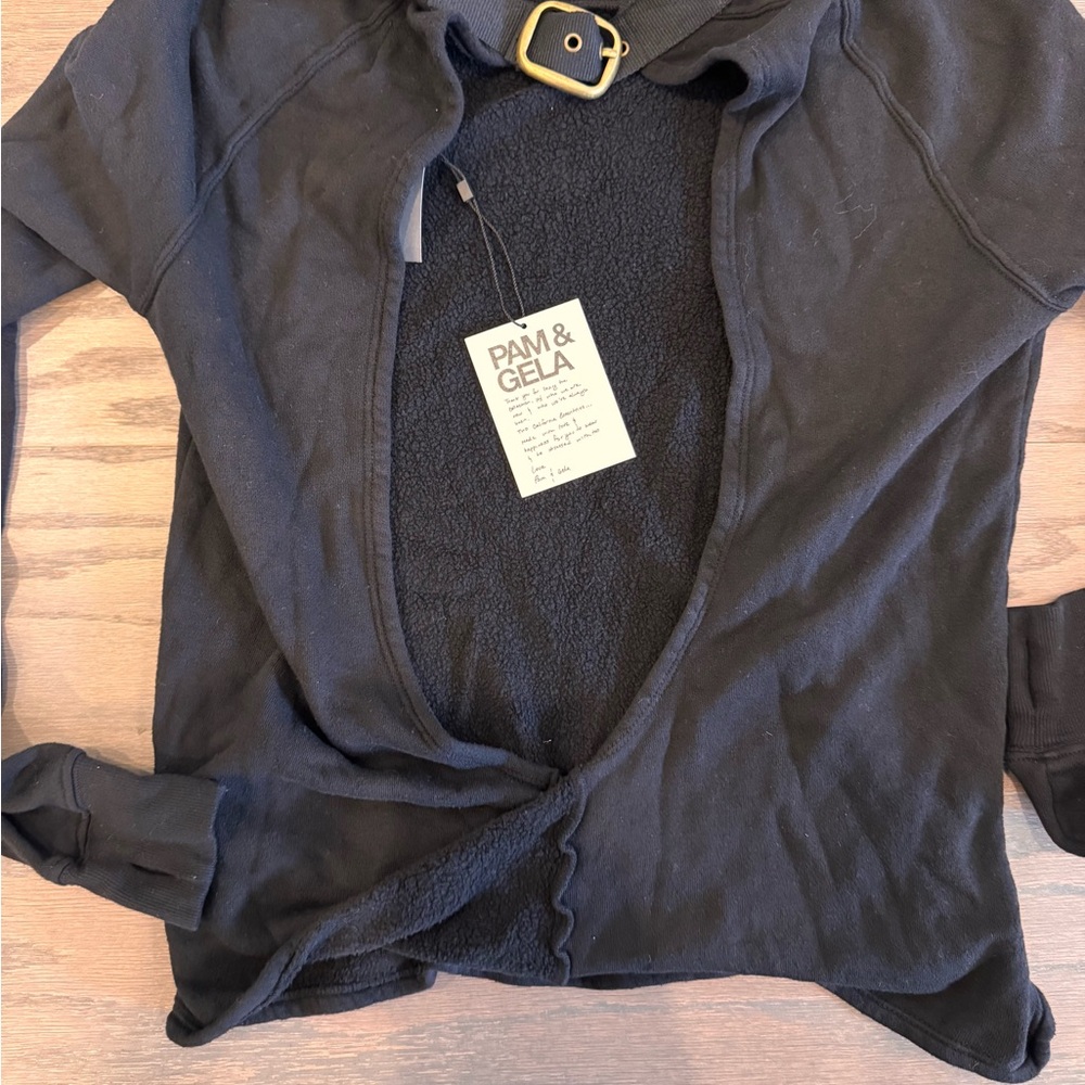 Pam & Gela Black Sweater with cut out back & gold buckle.